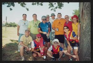 [Group posing under the shade of a tree: Lone Star Ride 2004 event photo]