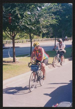 [Women cycling on a main road: Lone Star Ride 2004 event photo]