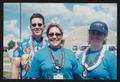 Photograph: [Crew member trio in blue: Lone Star Ride 2004 event photo]