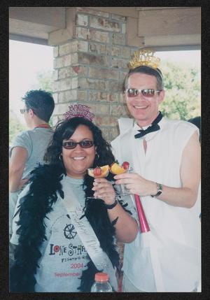 [Volunteer duo with fruit cocktails: Lone Star Ride 2004 event photo]