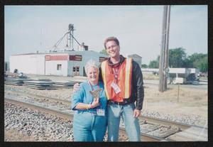 [Volunteer duo posed by a railroad track: Lone Star Ride 2004 event photo]