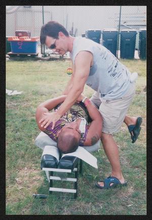 [Man getting a shoulder adjustment: Lone Star Ride 2004 event photo]