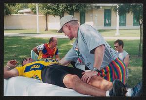 [Man on his back getting a massage: Lone Star Ride 2004 event photo]
