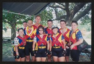 [Nine cyclists posing as a group: Lone Star Ride 2004 event photo]