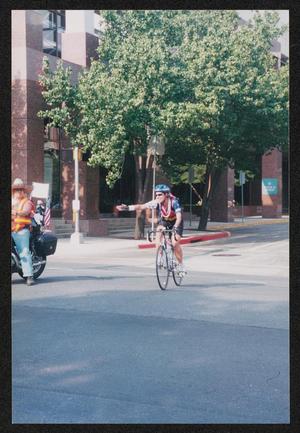 [Individual cyclist making an turn signal: Lone Star Ride 2004 event photo]