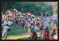 Primary view of [Cyclists crossing the finish line to a cheering crowd: Lone Star Ride 2004 event photo]