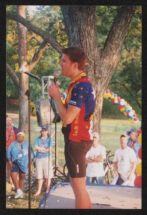 [Man speaking into a microphone: Lone Star Ride 2004 event photo]