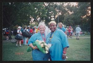 [Janie Bush holding a bouquet of white roses: Lone Star Ride 2004 event photo]