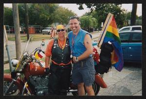 [Two people posing in front of a motorcycle: Lone Star Ride 2004 event photo]