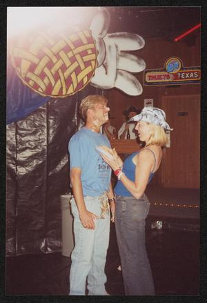 [A man covered in pie filling and a woman laughing together: Lone Star Ride 2001 event photo]
