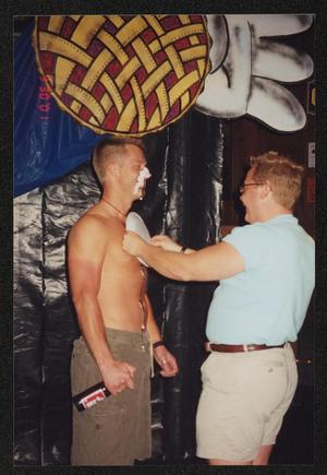 [Shirtless man getting pied in the chest: Lone Star Ride 2001 event photo]