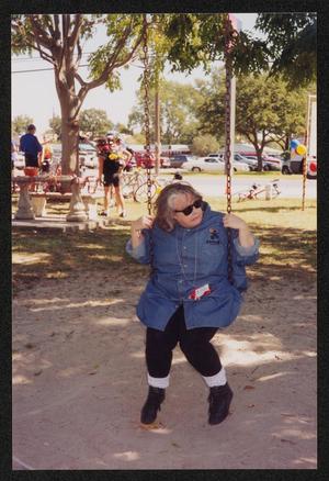 [Woman on the swing: Lone Star Ride 2001 event photo]