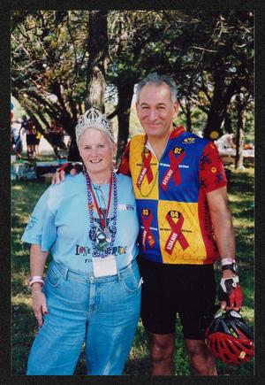 [Janie Bush and an older cyclist embracing: Lone Star Ride 2005 event photo]