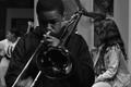 Photograph: [Boy plays trombone on Congo Street set]