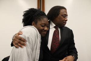 [Curtis King hugs student 2 at Congo Street awards ceremony]