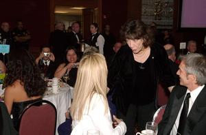 [Sharon Stone and man converse with Lily Tomlin, 2005 Black Tie Dinner]