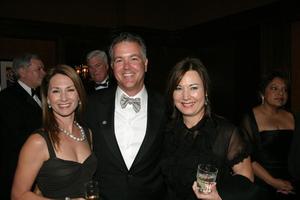 [Eric and Sheryl Maas with woman at 2005 Black Tie Dinner]