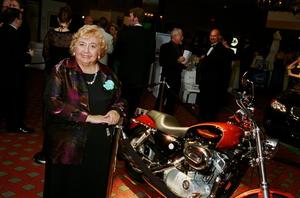 [Woman poses with a motorcycle, 2005 Black Tie Dinner]