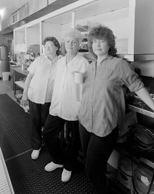 [Three women in a kitchen]