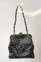 Physical Object: Woven leather handbag