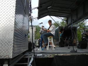 Primary view of object titled '[Aaron Einhouse on stage at John A. Lomax Texas Music Gathering]'.