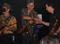 Photograph: [Saxophonists shake hands at Vicky G. Moerbe tribute concert]