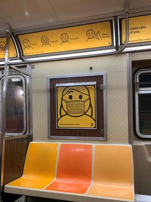 [New York City subway train interior and public service face mask poster]