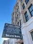 Primary view of [Clarke & Courts and Strand Lofts Building metal sign in Galveston, Texas]