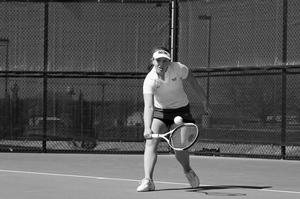 [UNT women's tennis player hits backhand during ULM match, 2]