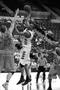 Photograph: [Jeffrey Simpson attempts to shoot ball during UT-Pan American game]