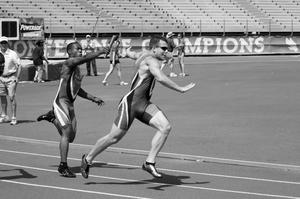 [UNT track members pass baton during Brooks/NT Spring Classic relay, 1]