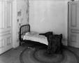Photograph: [A bed in the upstairs portion of Daddio's Jazz Café]