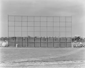 [Photograph of a fence on a baseball field]