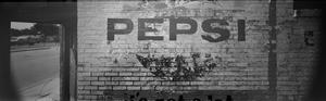 [A faded Pepsi sign]