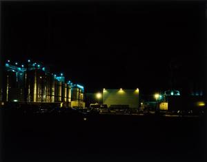 [An industrial site at night]