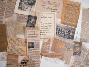 [Closeup of a collection of assorted clippings and loose pages]