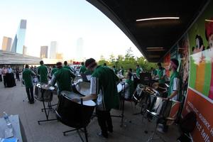 [Percussionists playing in the museum's courtyard, College of Music at the Perot Museum, 7]