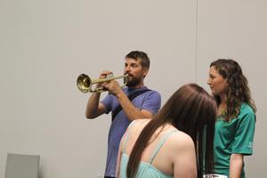 [Person playing a trumpet, College of Music at the Perot Museum]
