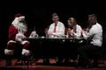 Primary view of [Santa Clause sitting with four musicians at the Percussion Holiday Performance, 2]