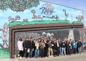 Primary view of object titled '[Band members in front of Nifty Nut House mural]'.