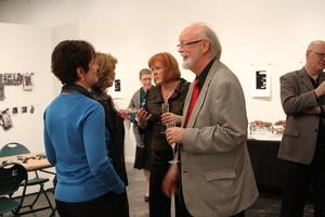 [Jerry McCoy and others conversing at the Jake Heggie post-concert reception]