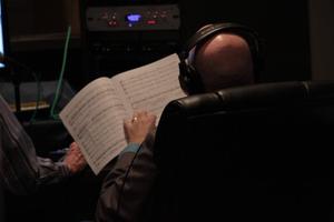 [Man with music sheet at the Jake Heggie Ahab Symphony recording session]