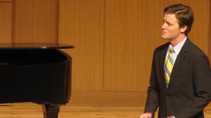 [Close-up of singer wearing a yellow tie at the Student recital during Jake Heggie's residency, 3]