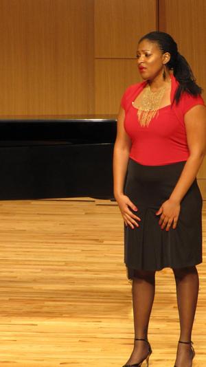 [Singer wearing a red blouse performing at the Student recital during Jake Heggie's residency, 9]