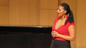 [Singer wearing a red blouse performing at the Student recital during Jake Heggie's residency, 10]