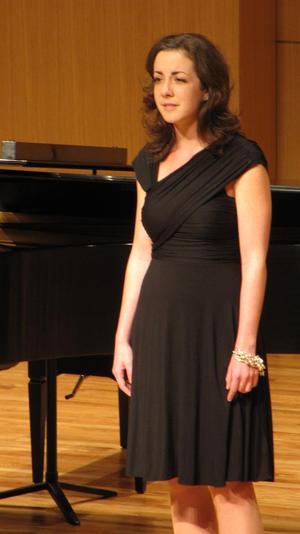 [Singer wearing black dress performing at the Student recital during Jake Heggie's residency, 6]