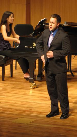 [Singer wearing purple tie performing at the Student recital during Jake Heggie's residency, 2]