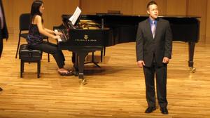 [Singer wearing purple tie performing at the Student recital during Jake Heggie's residency, 3]