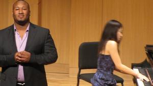 [Singer wearing purple shirt singing at the Student recital during Jake Heggie's residency, 2]
