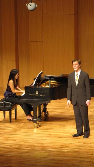 [Close-up of singer wearing a yellow tie at the Student recital during Jake Heggie's residency, 4]